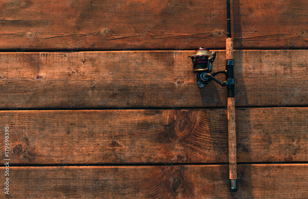 Premium Photo  Old fishing rod on wooden background