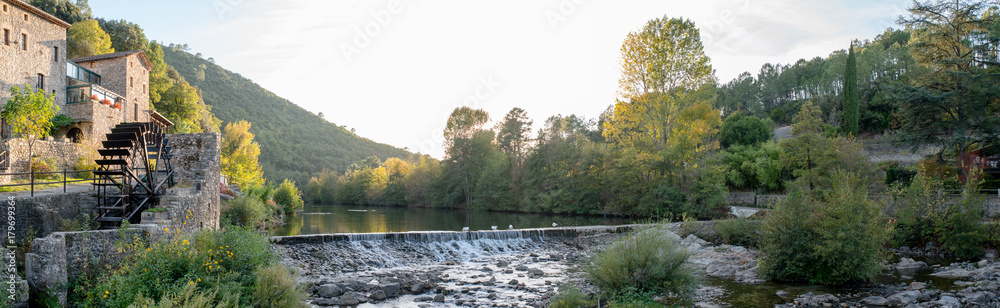 beautiful and colorful river mountain autumn fall season panoramic landscape with a watermill at sunset beautiful and colorful river mountain autumn fall season panoramic landscape with a watermill at sunset