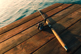 Fishing rod on a wooden background 