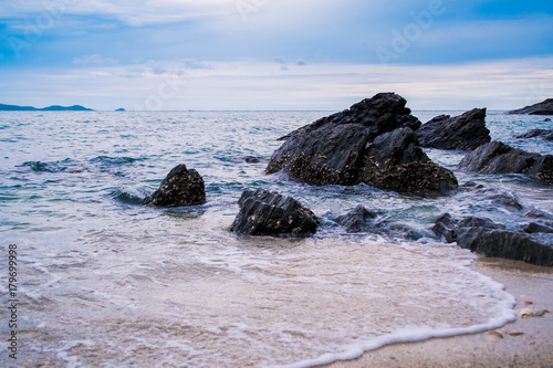 Fototapeta Naklejka Na Ścianę i Meble -  sea wave with rock on the beach.Tropical sea in Thailand