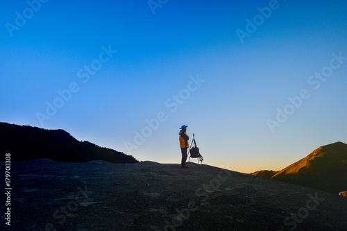 Taiwan  Hehuan mountain - October 21th. 2017 silhouette of     photographer on top of mountain at sunset background  