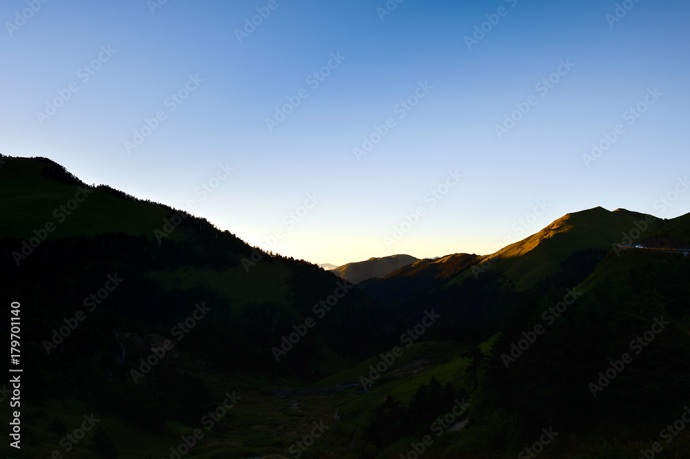 silhouette of beautiful mountain with blue sky at sunset
