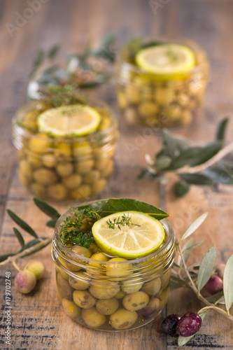 Green olives preserved in jar, preserve photo