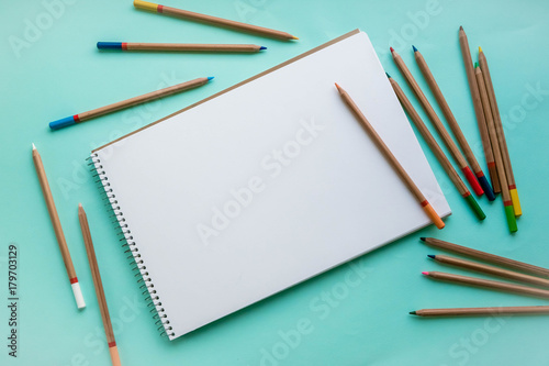 Wallpaper Mural An empty sheet of sketchbook or album for drawing on a pink, blue background. Drawing a still life. Flat lay stock photo. Creativity concept. Torontodigital.ca