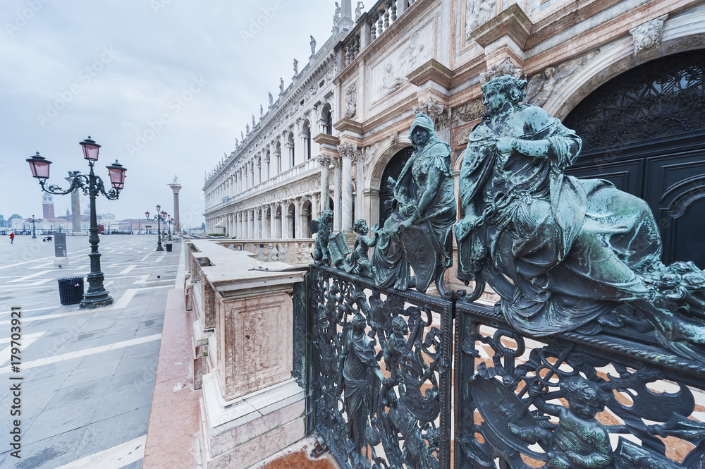 Fototapeta premium Decorative metal gate ornament. Antique iron door with classic ornaments of Campanile in Doge's palace, Venice, Italy
