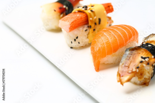 assorted sushi on white plate isolated on white back ground
