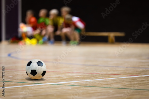 Football Futsal Ball and Youth Team. Indoor Soccer Sports Hall. Children Indoor Soccer Team. Sport Futsal background. Indoor Soccer Winter League for Kids