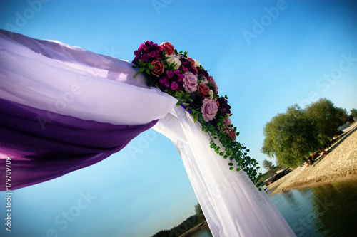 wedding arch on the background of water