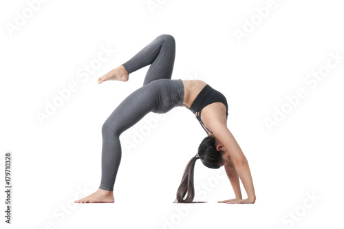 Asian young woman doing yoga isolated on white background, healthy and fitness concept.
