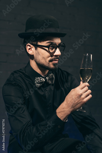 fashionable man with glass of champagne