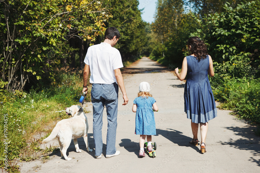 happy family with pet dog at picnic in a Sunny summer day. pregn happy family with pet dog at picnic in a Sunny summer day. pregn