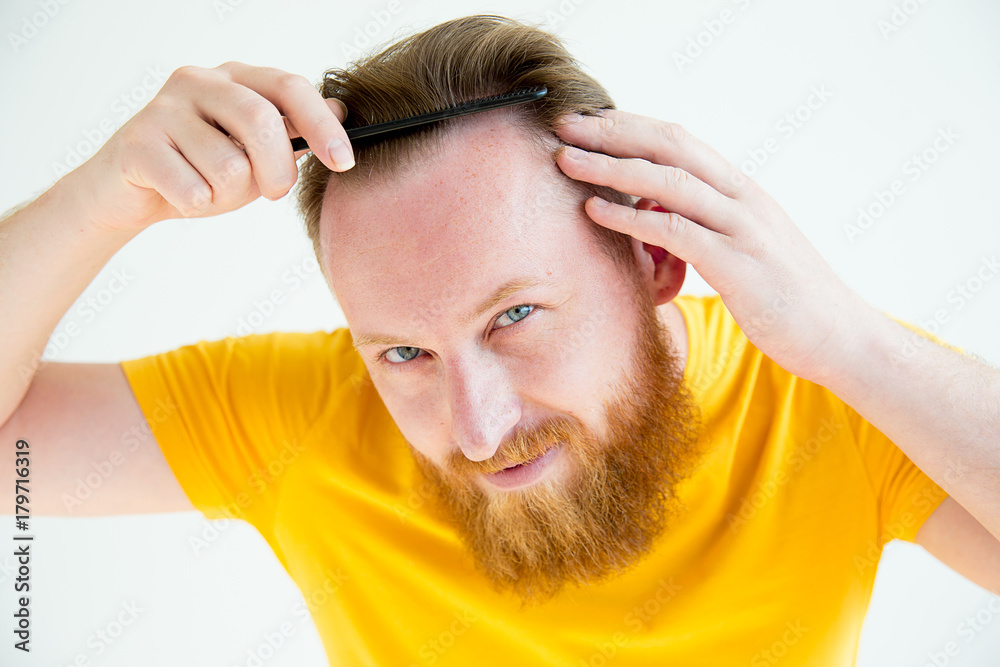 Guy trimming his beard