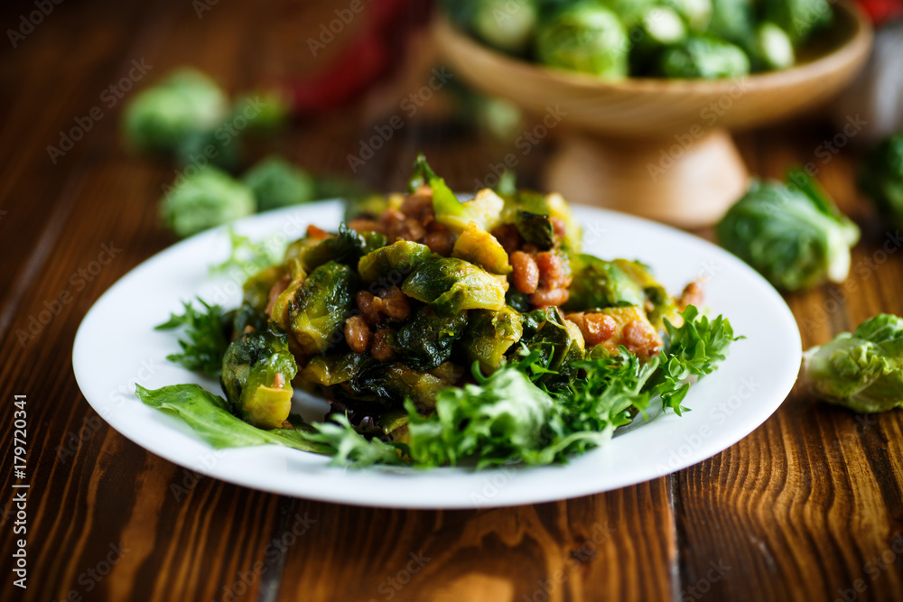 Brussels sprouts fried with beans close-up