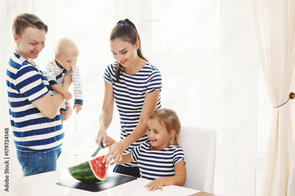 Happy family eating watermelon Happy family eating watermelon