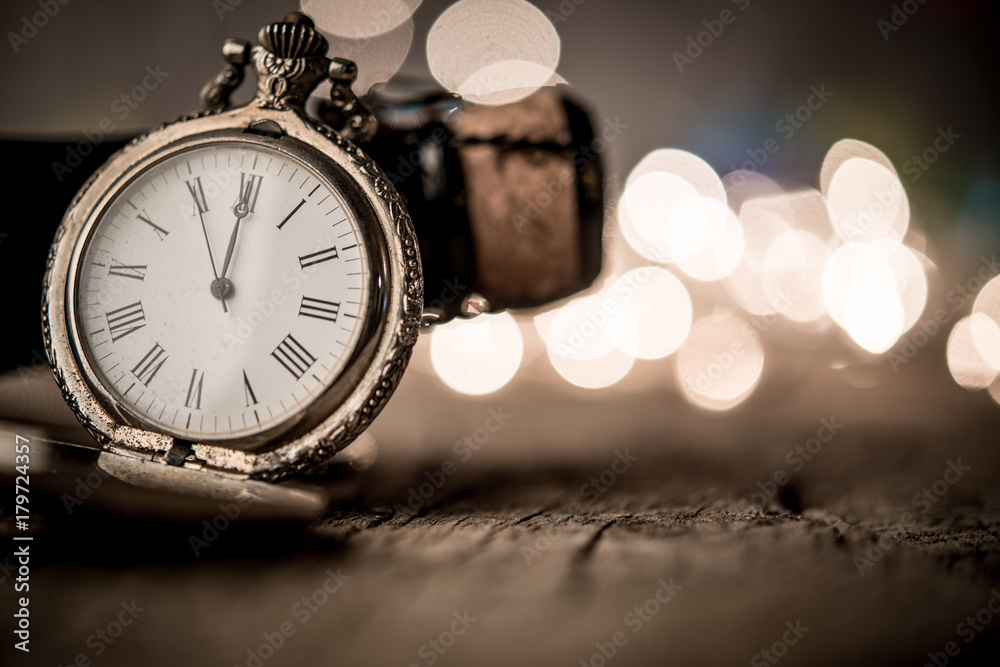 New Year or Christmas background with wine bottle and clock