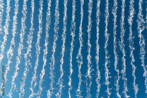 Canvas-taulu water jets over a blue sky