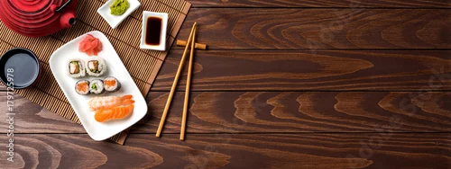 Obraz  z motywem Set of sushi with red teapot and chopsticks