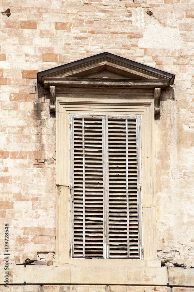 Gubbio, Perugia, Italy -  Piazza Grande, in Gubbio, architectural details of the ancient palaces