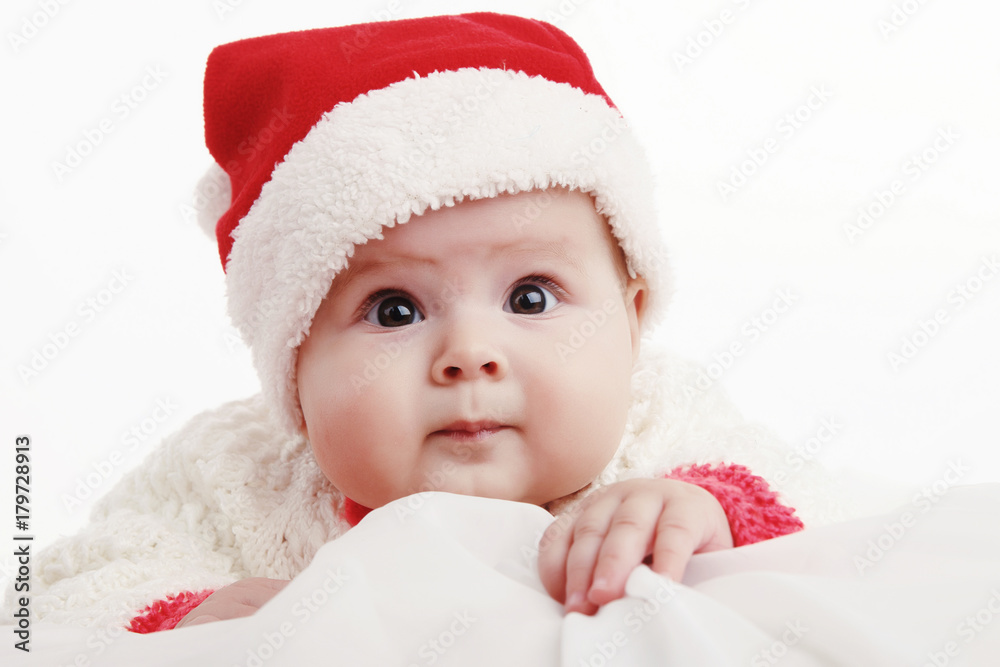 Beautiful girl in Christmas costume with Christmas balls toys. In Studio on white background isolated Beautiful girl in Christmas costume with Christmas balls toys. In Studio on white background isolated