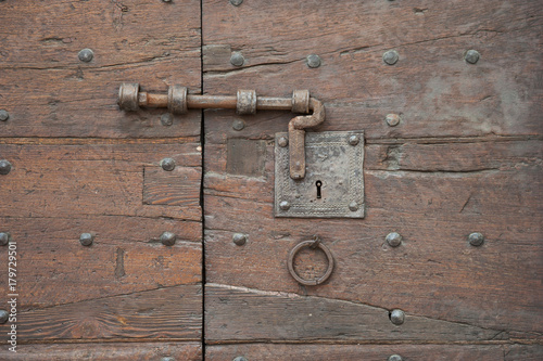 Gubbio, Perugia, Italy - ancient door latch, architectural details of the ancient palaces