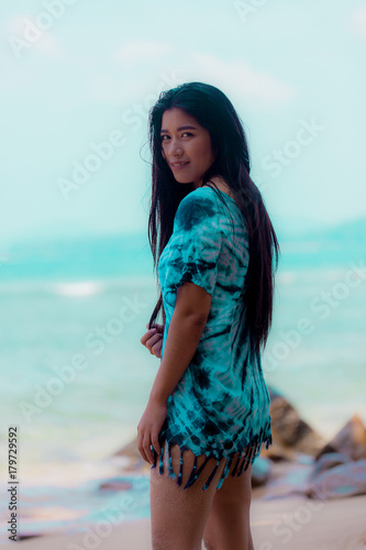 portrait sexy Asian woman posing on the beach for relax 