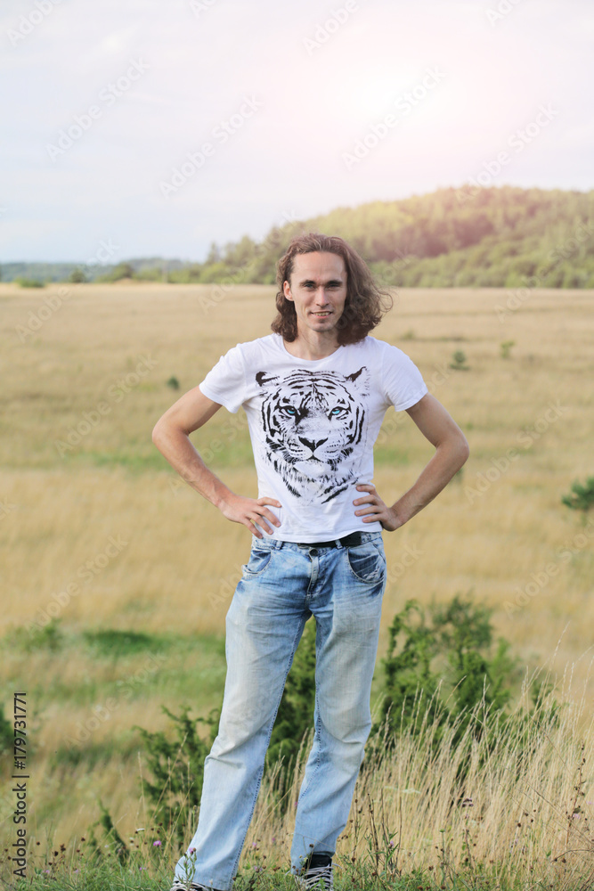 Portrait of young smiling man posing at nature Portrait of young smiling man posing at nature