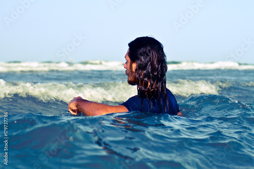 Young man, inside the waves, at the sea © Mika