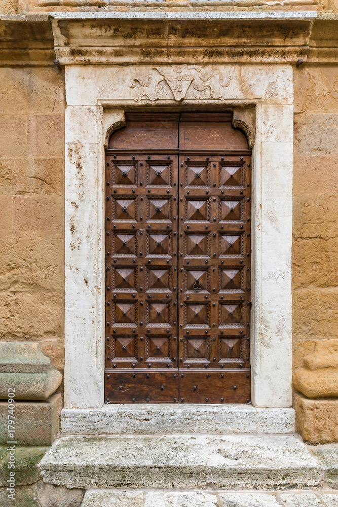 Massive wooden doors typical of southern Italy