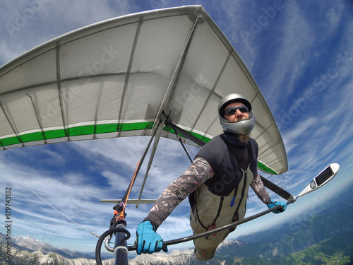 Selfie shot of hang glider pilot soaring the thermal updrafts