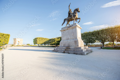 View on the beautiful Peyrou promenade with Louis statue in Montpellier city during the morning light in southern France photo