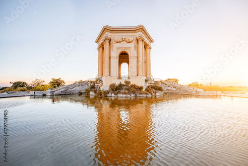 фотографія View on the water tower in Peyrou garden with beautiful water reflection during
