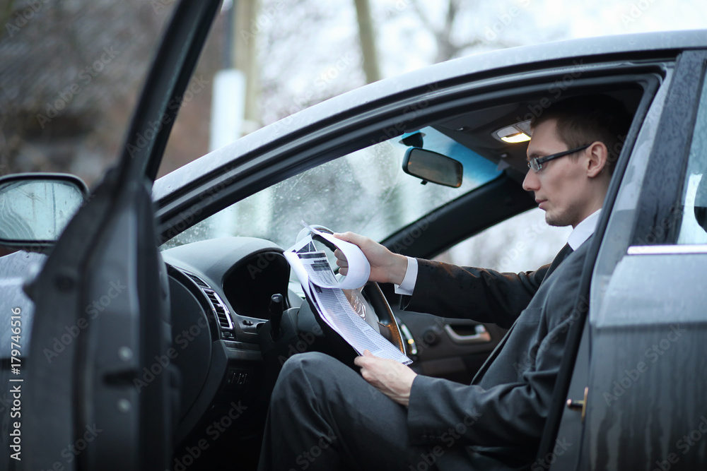 Man in a business suit in the car Man in a business suit in the car