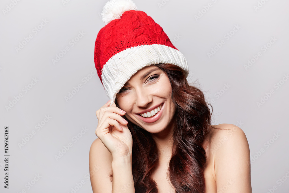 smiling beautiful girl in christmas cap smiling beautiful girl in christmas cap