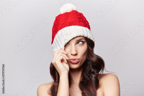 smiling beautiful girl in christmas cap
