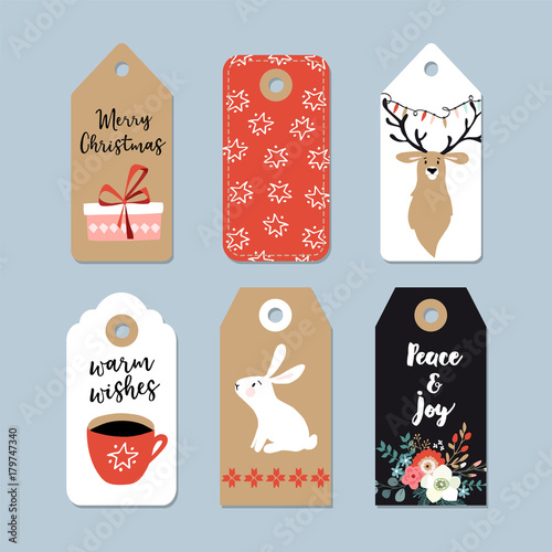 Vintage Christmas gift tags set. Hand drawn labels with bunny, deer, polar bear, cup of coffee and winter flowers. Isolated vector illustration objects.