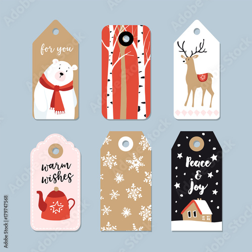 Vintage Christmas gift tags set. Hand drawn labels with birch trees, deer, polar bear and tea pot. Isolated vector illustration objects.