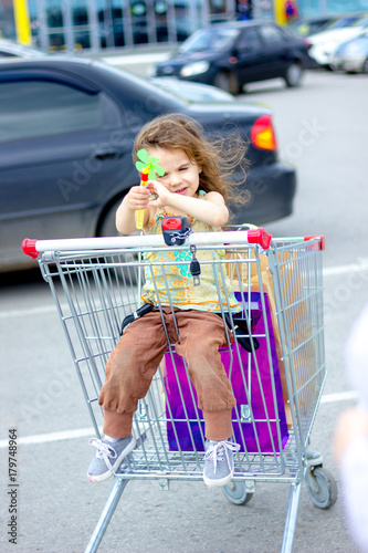 Little kid girl sitting in ...