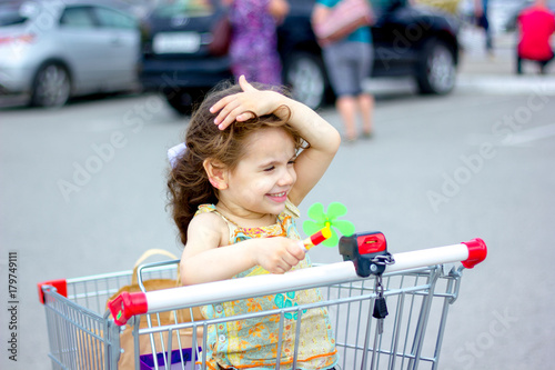 Little kid girl sitting in ...