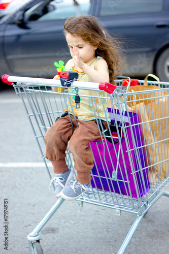 Little kid girl sitting in ...