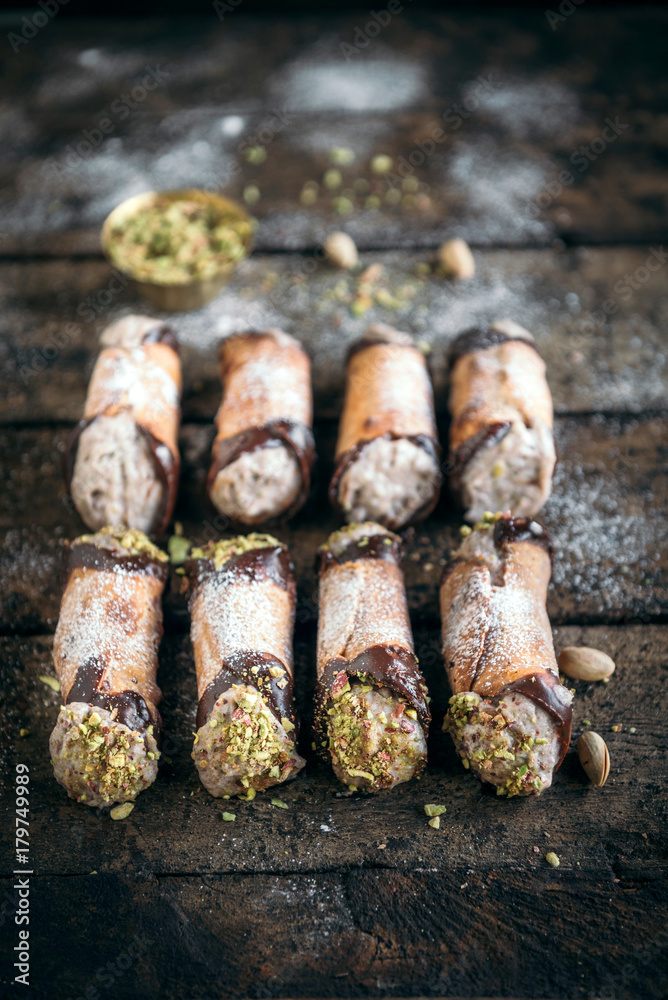 Cannoli dessert with pistachio served on the table,selective focus Cannoli dessert with pistachio served on the table,selective focus