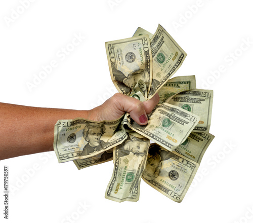 Horizontal shot of a woman's hand grasping a lot of twenty dollar bills on a white background.