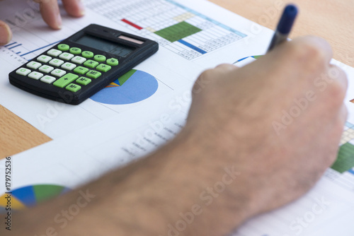 Calculator and accounting documents on a table