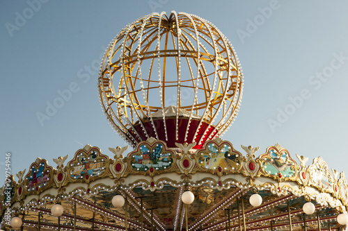 A colorful carousel and a blue sky © CoolimagesCo