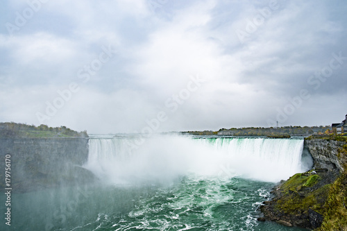 Landscape view of the amazing Niagara Falls seen from the Canadian border in Autumn.