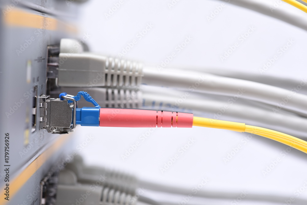 Data center, fiber optic and network cables connected to the switch Data center, fiber optic and network cables connected to the switch