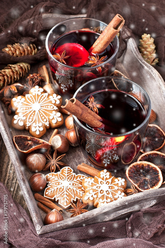 Christmas composition with hot spiced wine and tasty cookies