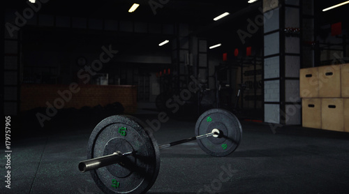 Heavy barbell on the floor of a gym studio