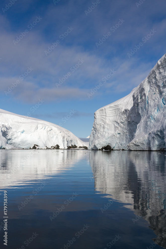 Reflecting gletchers in a bay near Melchior Islands, Antarctic Peninsula, Antarctica.