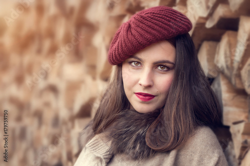 Portrait of a beautiful young woman in a red hat.