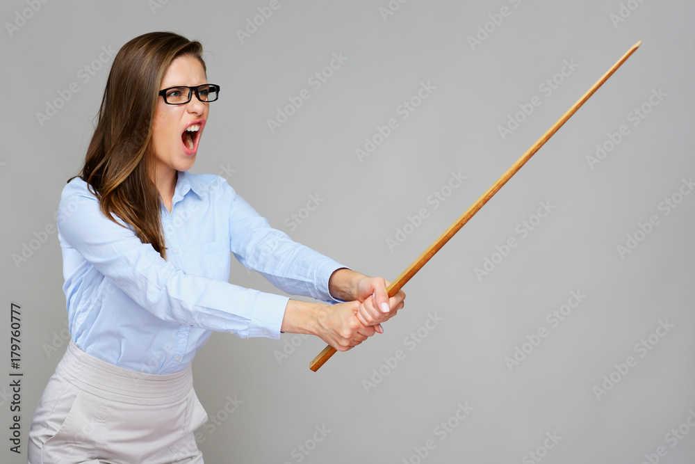 Wicked woman teacher screams, holding pointer wand. Wicked woman teacher screams, holding pointer wand.